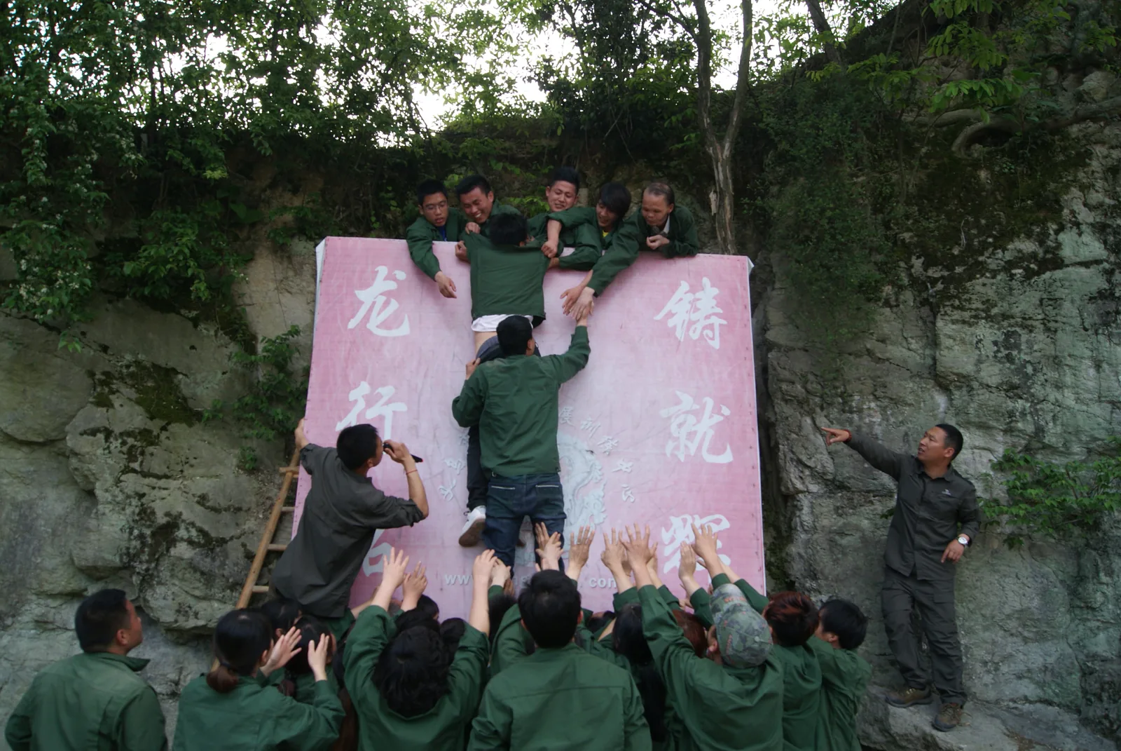 ARIS team-building activity with members supporting each other