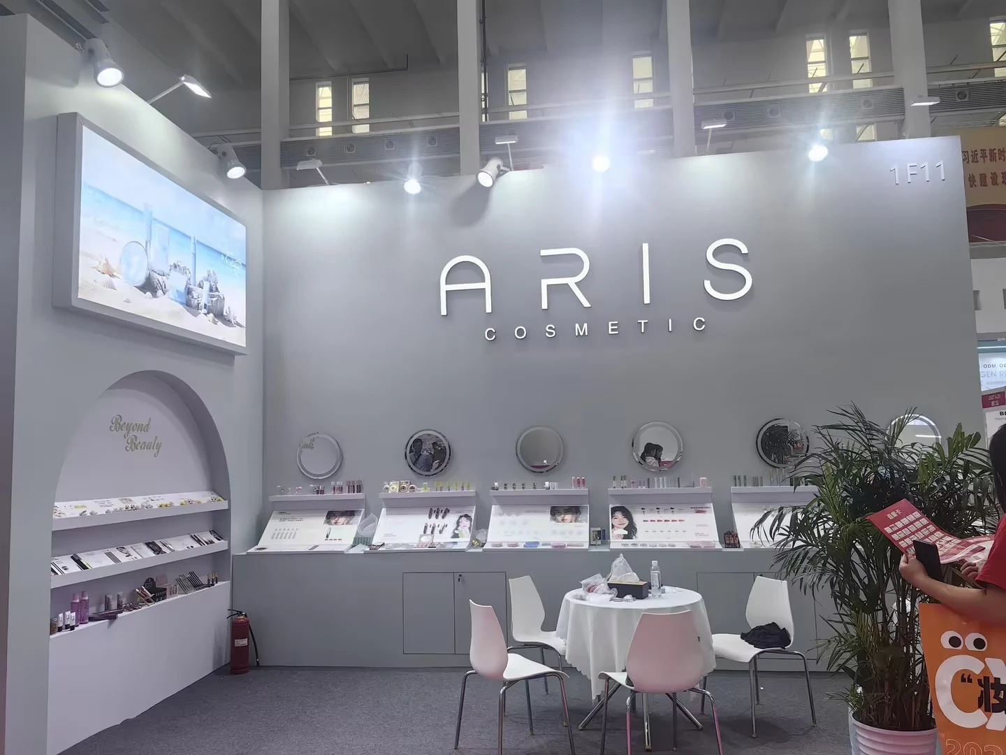 ARIS Cosmetics exhibition booth 1F11 with Beyond Beauty arch and 5-mirror consultation station